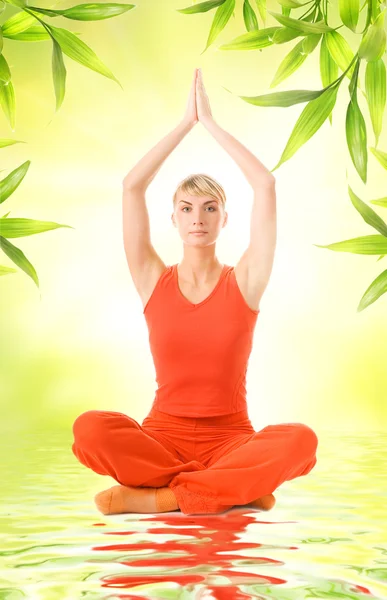 Beautiful young woman doing yoga exercise — Stock Photo, Image