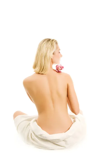 Schöne junge Frau mit Orchideenblüte isoliert auf weißem Rücken — Stockfoto