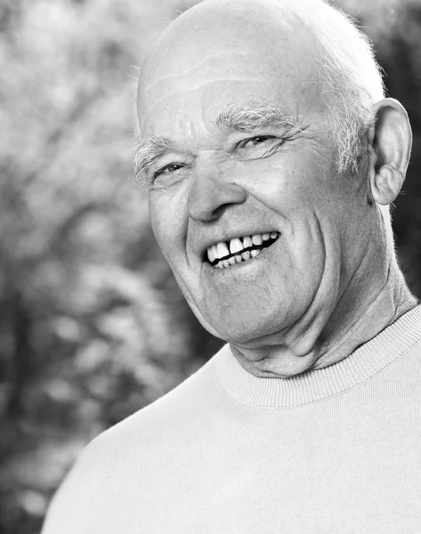 Monochrome potrait of happy elderly man — Stock Photo, Image