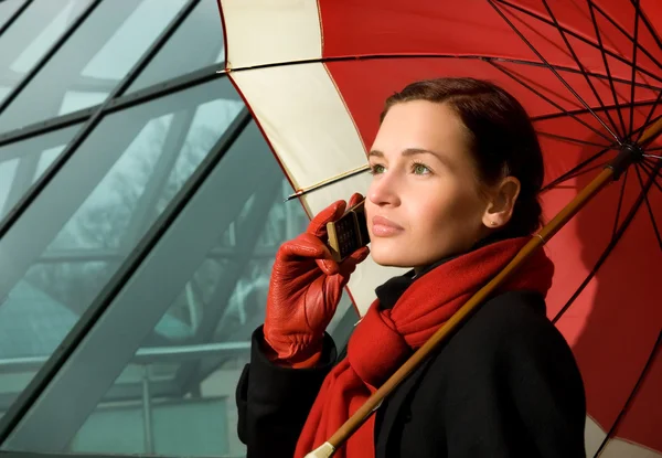 Beautiful Brunette Red Umbrella Talking Phone — Stock Photo, Image