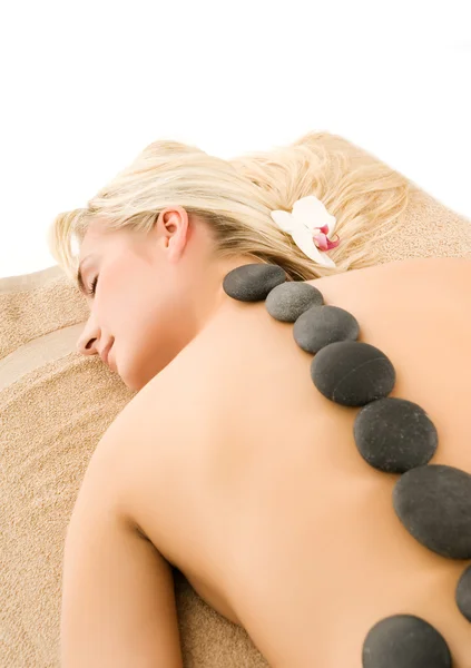 Massage met warme vulkanische stenen — Stockfoto