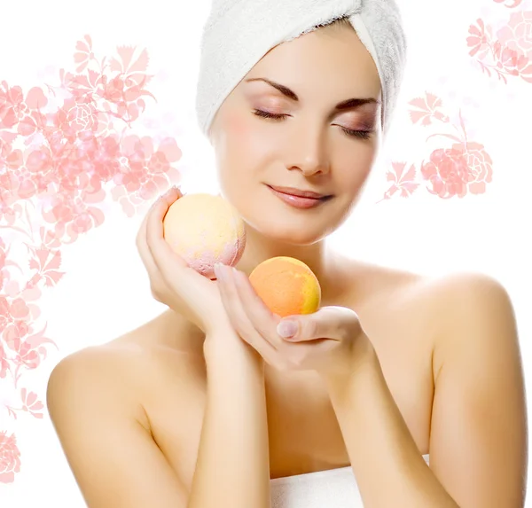 stock image Lovely young woman with aroma bath ball in her hands.