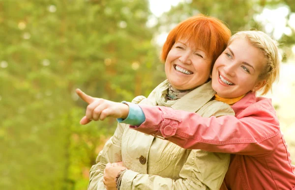 Mother and daughter having fun outdoors Stock Image