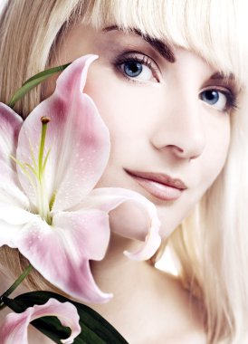 Beautuful woman with pink lily high-key portrait clipart