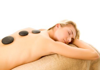 Massage with hot volcanic stones clipart