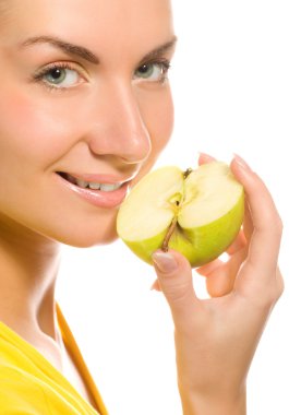 Young beautiful woman with apple slice isolated on white background clipart