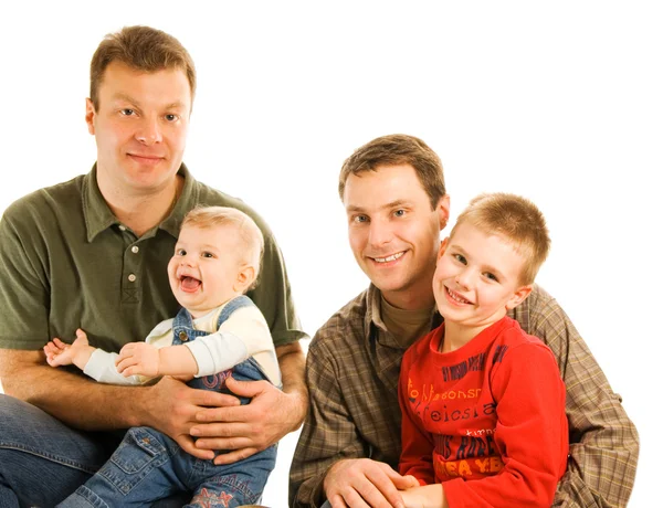 Två pappor med barn isoleras på vit bakgrund — Stockfoto