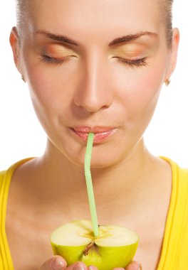 Beautiful girl drinks natural apple juice clipart