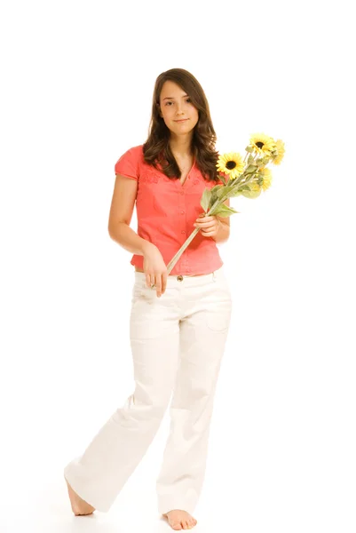 Beautiful teenage girl holding bunch of sunflowers isolated on w — Stock Photo, Image