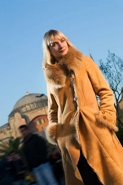 Beautiful blond girl wearing winter coat — Stock Photo, Image