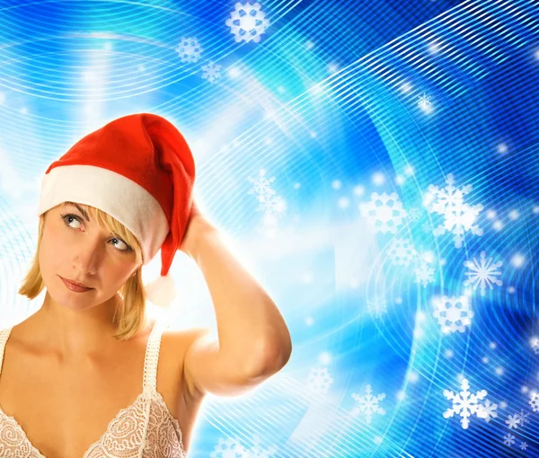 クリスマス帽子抽象的な冬の背景上で美しい少女 — ストック写真