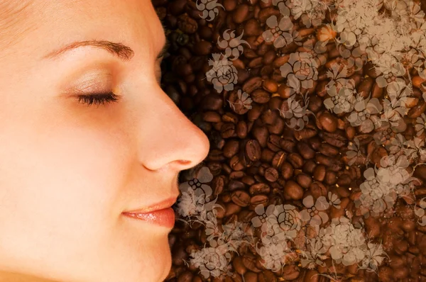 Beautiful girl breathing in scent of coffee — Stock Photo, Image