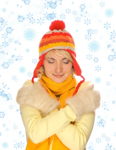 Gefrorenes Mädchen in bunter Winterkleidung und abstrakten Schneeflocken — Stockfoto