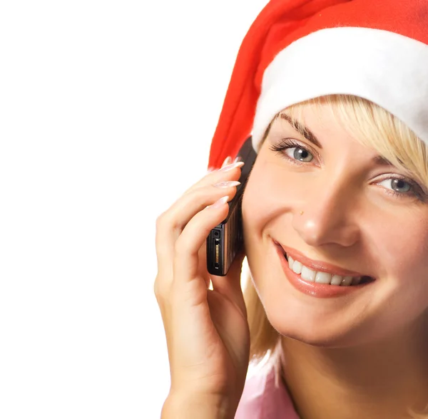 La chica de Navidad habla por teléfono. Aislado sobre fondo blanco Fotos de stock libres de derechos