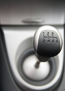 Six speed gear stick in a brand new sport car (shallow DoF) clipart