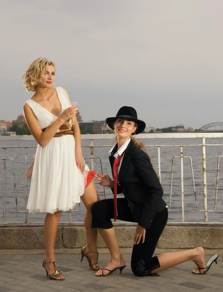 stock image Portrait of two beautiful girls near the river