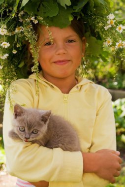 Little girl with a kitten clipart