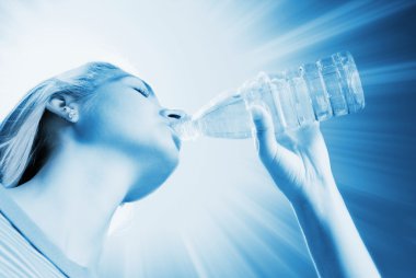 Beautiful blond girl drinking water (toned in blue) clipart