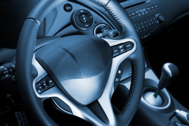 Car interior toned in blue clipart