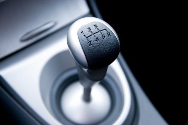 Six speed gear stick in a brand new sport car (shallow DoF) clipart