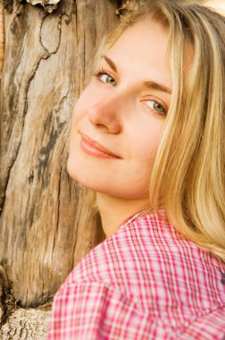 Beaututiful blond girl in the forest clipart