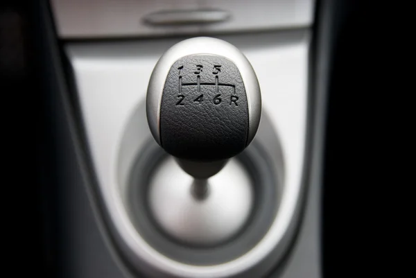Six speed gear stick in a brand new sport car (shallow DoF) — Stock Photo, Image