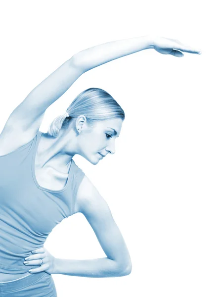 Mooi meisje opleiding fitness geïsoleerd op wit (afgezwakt in blauw — Stockfoto