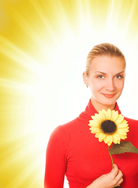 Beautiful girl with a sunflower on abstract background — Stock Photo, Image