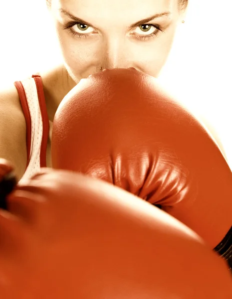 Sepia toned portrait of a girl with red boxing gloves — Stock Photo, Image