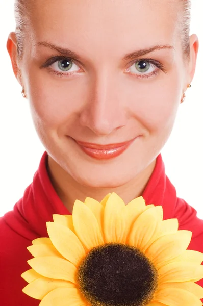 Attractive young girl with a sunflower — Stock Photo, Image