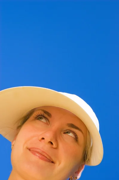 Funny girl's face isolated over blue Stock Picture