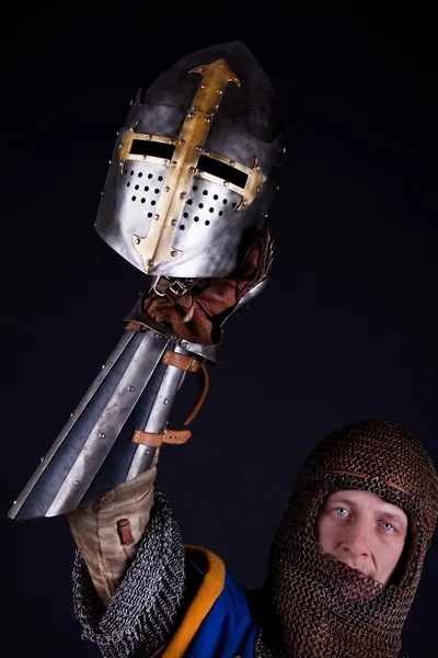 Mighty knight holding a helmet — Stock Photo, Image