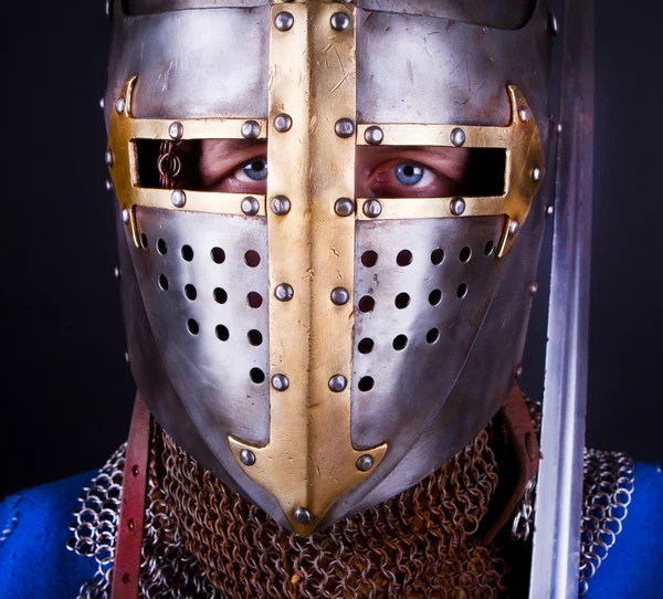 Blue eyes of knight Stock Picture