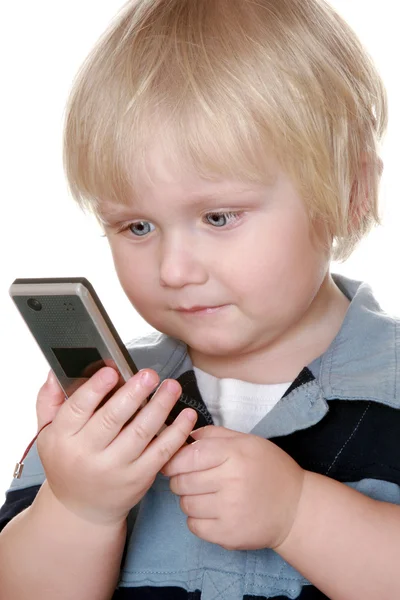 Młody chłopak gospodarstwa telefon komórkowy — Zdjęcie stockowe