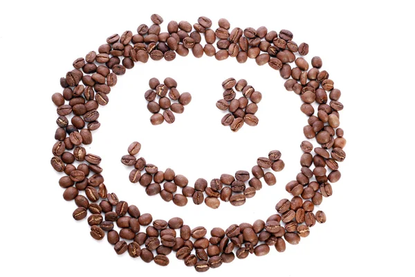 Kahve çekirdekleri içinde gülümse — Stok fotoğraf