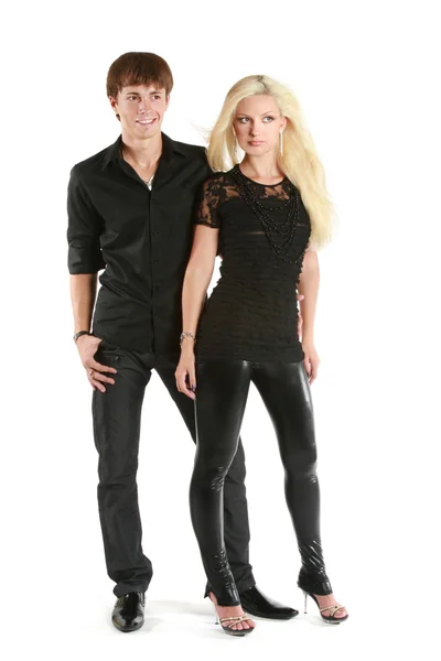 Beautiful young couple in black shirts on white — Stock Photo, Image