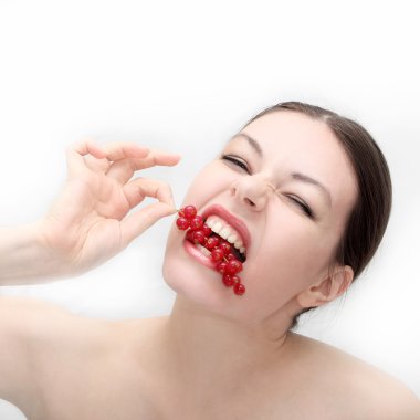 Girl eats a currant clipart