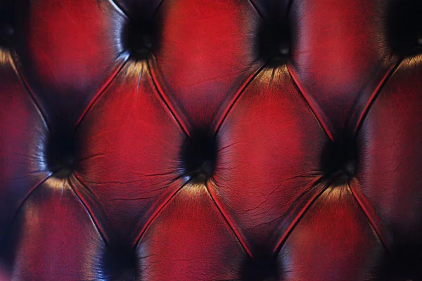 Красная фотография подлинной кожаной обивки — стоковое фото