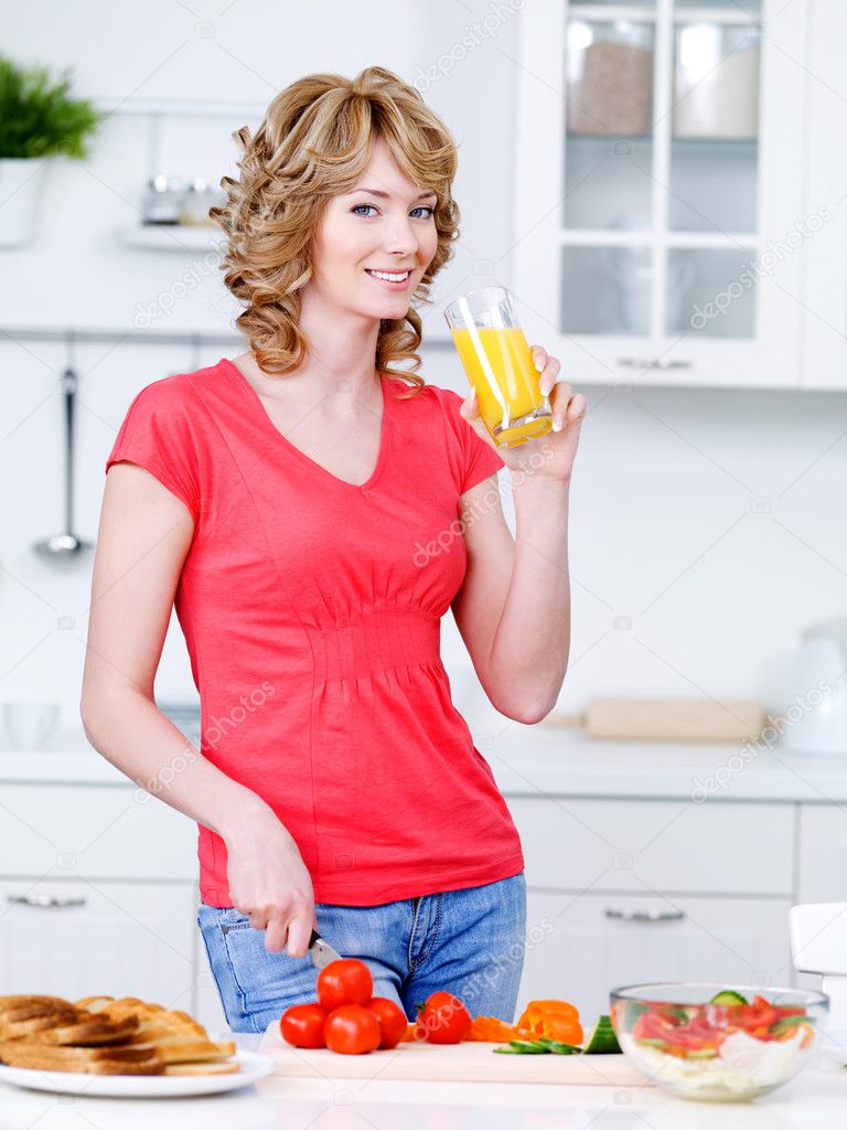 Woman drinking juice and cooking — Stock Photo © valuavitaly 3468634