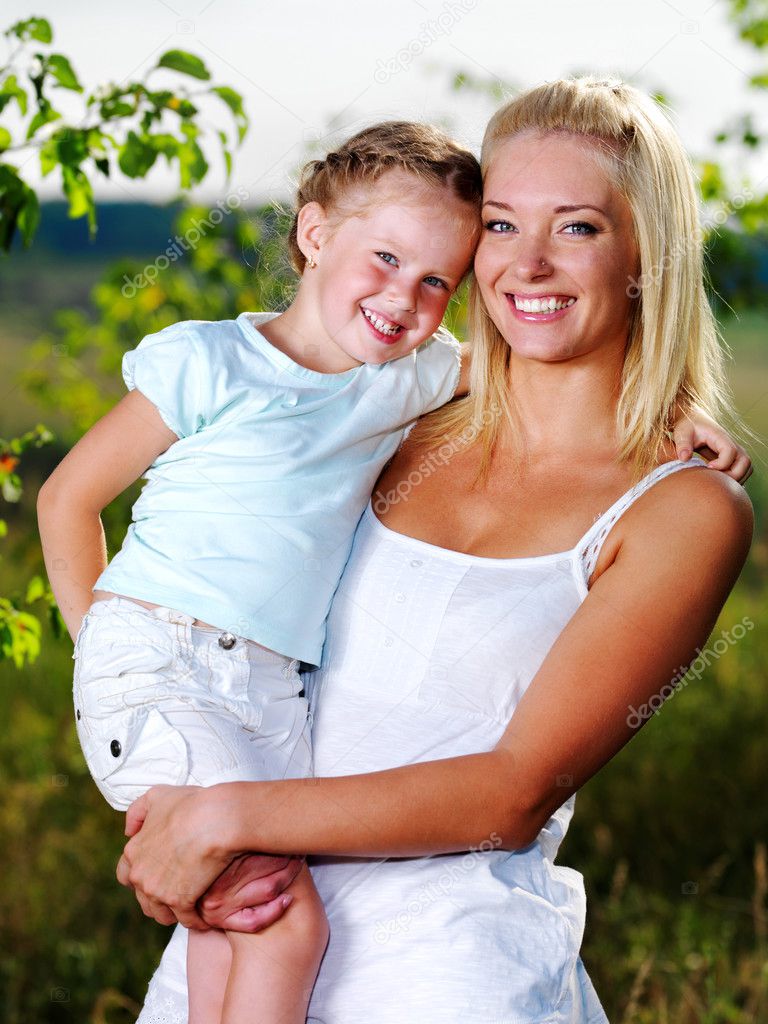 Portrait of mother and daughter outdoors — Stock Photo © valuavitaly ...