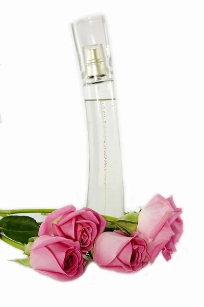 Láhev parfémy a růže — Stock fotografie