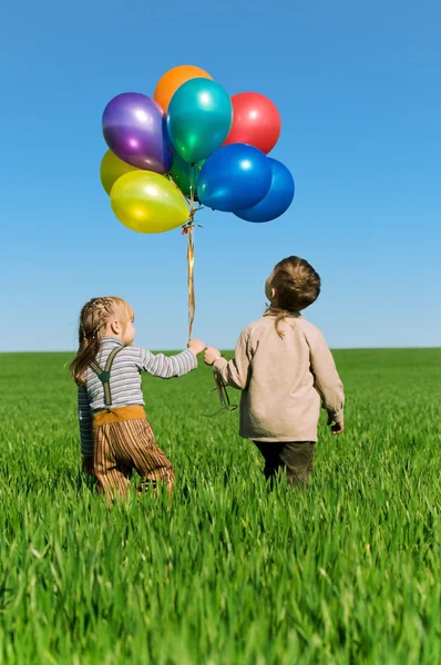 Děti s balónky — Stock fotografie