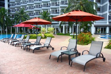 Poolside Deckchair at Luxury Hotel clipart