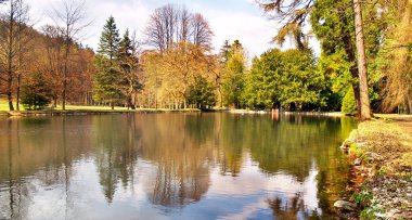 Colorful park and lake in autumn clipart