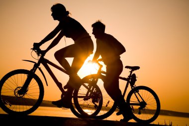 Sporty couple on bicycles