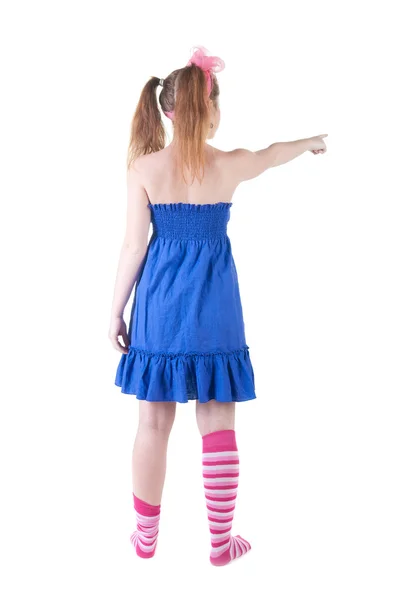 Young teenager girl points at wall. — Stock Photo, Image