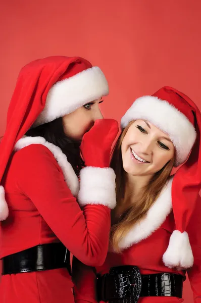 Två glada unga santa flicka talar — Stockfoto