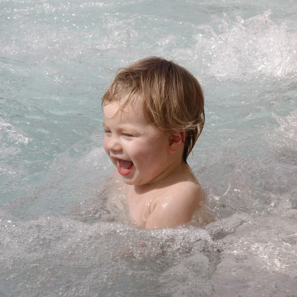 Little baby girl swimming in jacuzzi — Stock Photo, Image