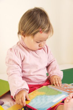 Baby with book clipart