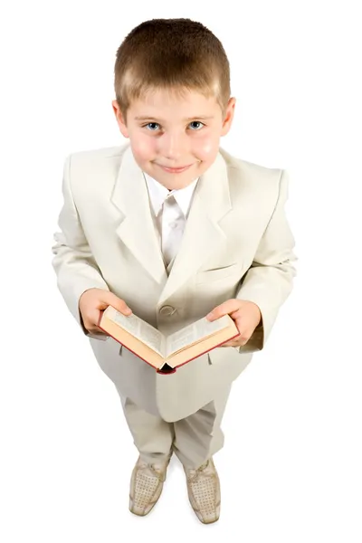 Goed geklede lachende jongen houdt boek — Stockfoto